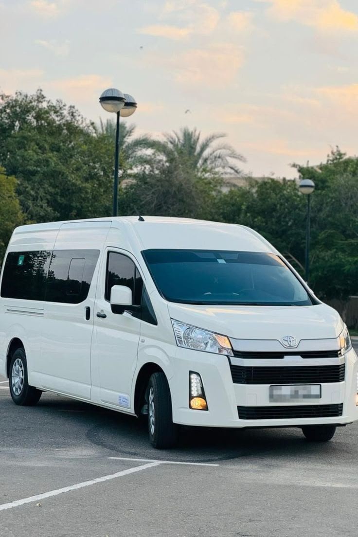 White Toyota HiAce high-roof van for group Umrah and Hajj transfers