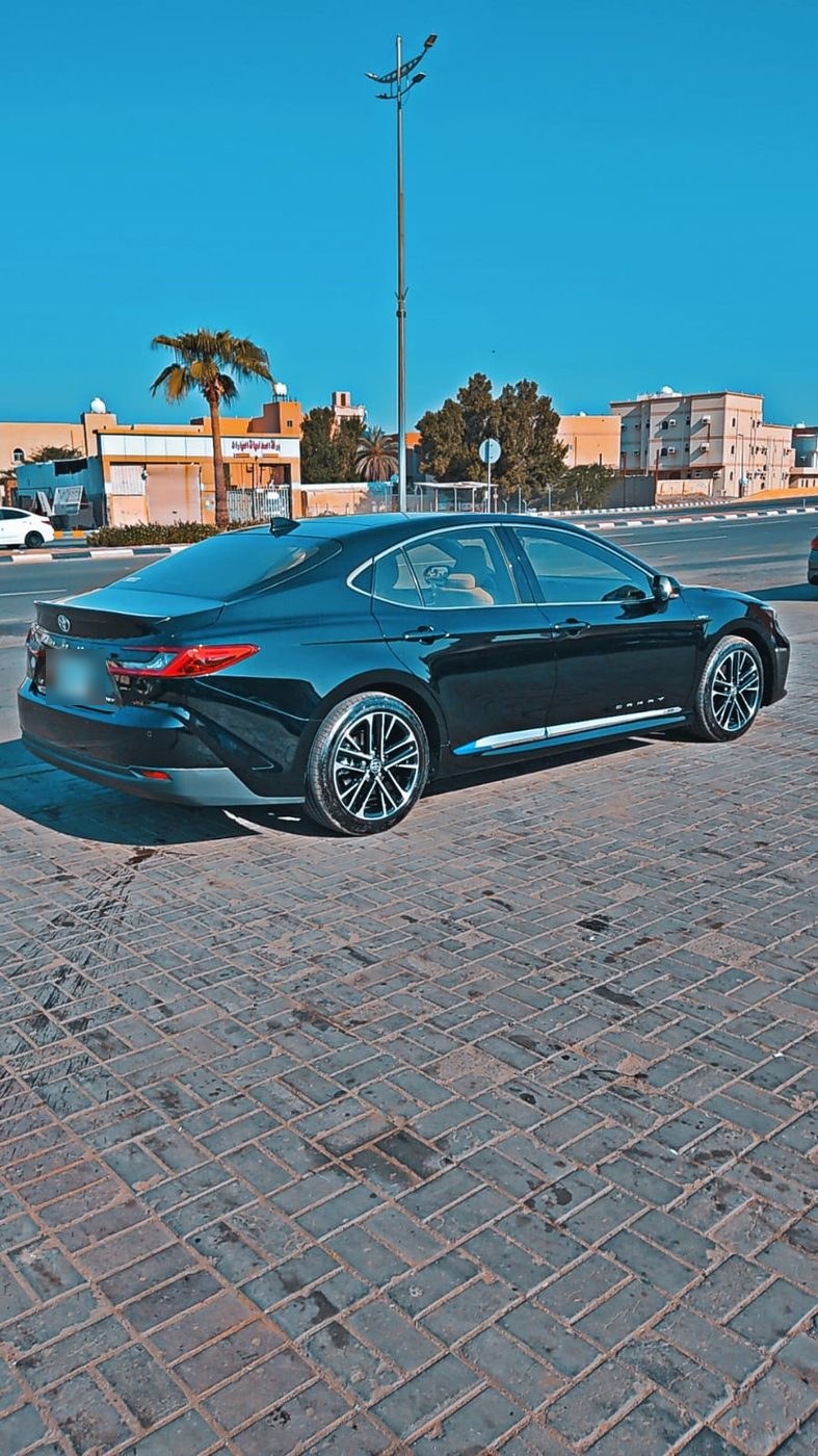 Toyota Camry sedan rear view for Jeddah airport transfers